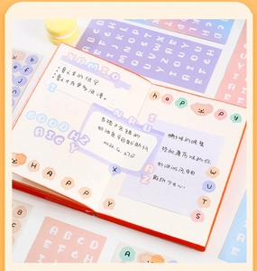 Close-up of pastel Morandi letter stickers on notebook for DIY scrapbooking and planners