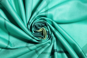 Macro shot of teal plaid fabric with soft twill texture and smooth weaving detail