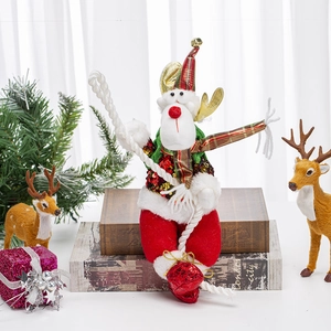 Detailed plush reindeer figurine with festive sequins on a cozy holiday setting