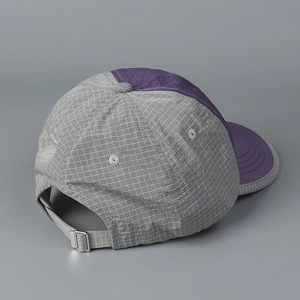 Detail view of adjustable silver metal buckle on lightweight plaid quick-dry baseball cap