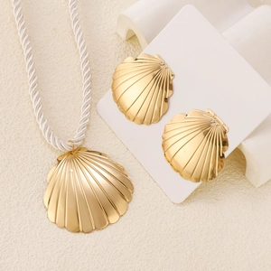 Elegant gold scallop shell pendant necklace and earrings set with white cord strap
