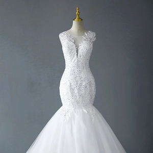 Elegant white mermaid wedding dress with V-neckline and intricate floral lace detailing