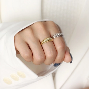 Elegant croissant dome rings in gold and silver finish worn by a model