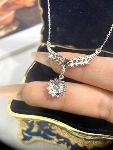 Macro shot of 925 sterling silver sunflower pendant with a brilliant center stone