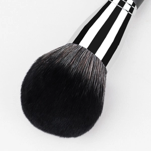 Large powder brush with soft gradient bristles and silver metal ferrule on white background