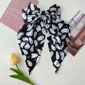 Halloween large bow hair clip featuring white ghost print and Boo text on black ribbon