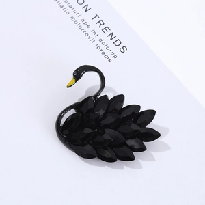 Elegant black crystal swan brooch pin for suits, featuring faceted stones and a minimalist look