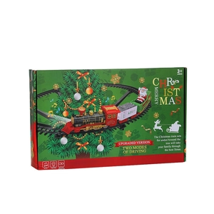 Electric Christmas tree train set with music and lights in festive green packaging box