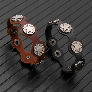 Vintage leather bracelets in black and brown featuring five-pointed star metal studs