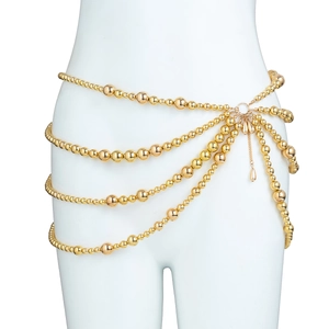 Detailed view of layered gold beaded waist chain with elegant metal pendants for beachwear