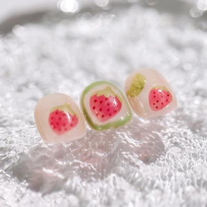 Translucent nude strawberry nail stickers with 3D embossed designs on water background