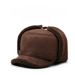 Close-up of warm brown winter hat with thick faux fur lining and metal sports logo