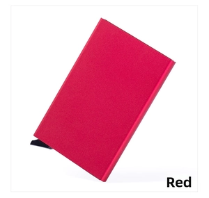 Detail view of red aluminum RFID card case with sliding push-button mechanism