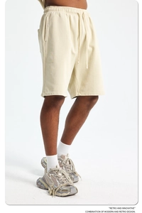 Detail view of retro beige washed cotton shorts with adjustable drawstring and elastic waist