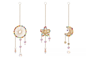 Detailed macro view of golden crescent moon crystal suncatcher with colorful bead accents