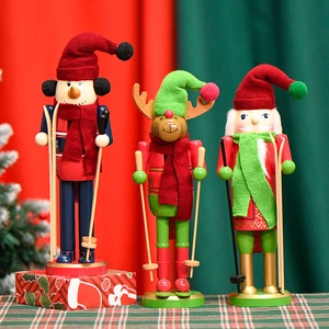Three wooden 30cm Christmas nutcrackers featuring snowman, deer and Santa on skis