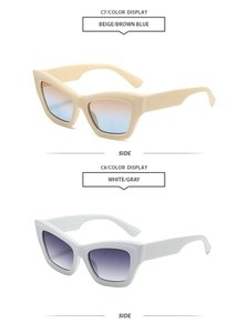 Detail view of cat eye sunglasses in beige and white frames with gradient lenses