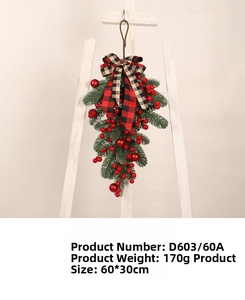 Detailed Christmas teardrop swag with red berries and a plaid bow measuring 60x30cm