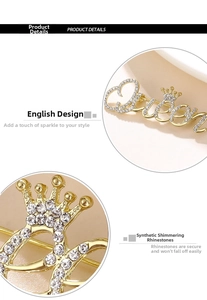 Detailed macro view of the Queen letter brooch with crown and sparkling rhinestones