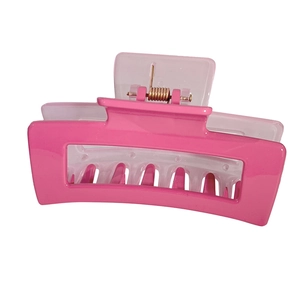 Bright pink large rectangular hollow hair claw clip with metal spring on white background
