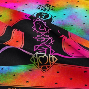 Close-up of vibrant Seven Chakra tapestry fabric with digital print and star details