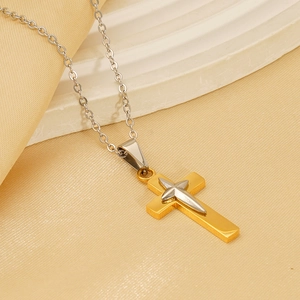 Retro 18K gold and silver layered cross pendant necklace for women on beige fabric