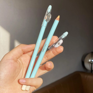 Detail of light blue concealer pencils with built-in sharpener caps by GECOMO
