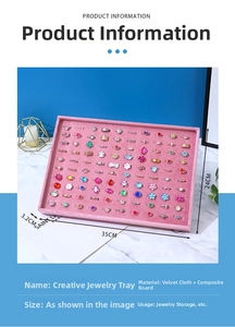 Pink velvet jewelry display tray with multi-slot organizers for rings and earrings