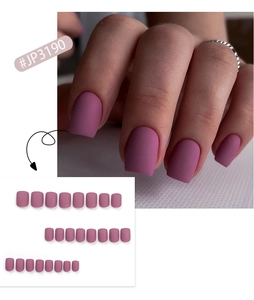 Detailed view of matte mauve short square press on nails showing model wear and tips