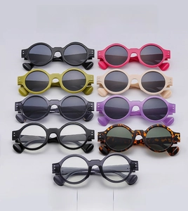 Detailed grid of vintage round sunglasses in various colors with metallic stud accents