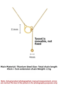Detail of 11mm cat head pendant with 4mm bead tassel on a gold titanium steel necklace
