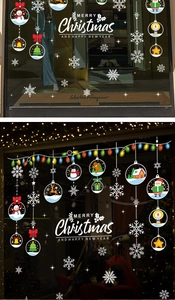 Macro detail of festive Christmas window stickers featuring colorful ornaments and snowflakes