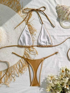 Detail of metallic gold string bikini set with tied halter top and high cut bottoms