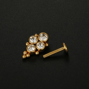 Golden labret stud with four clear zircons in flat back piercing jewelry design