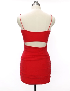 Detail of red glitter bodycon dress showing back cutout and ruched fabric texture
