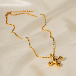 Detail of 18k gold stainless steel cross necklace with tiger eye stone on silk
