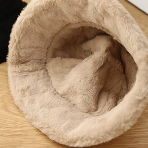 Detail view of the thick warm plush lining on the beige winter bucket hat