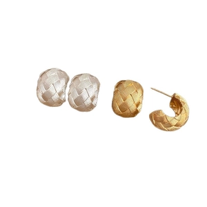 Minimalist woven texture C-shaped hoop earrings in gold and silver finish on white background