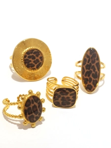 Detailed view of four 18K gold-plated rings featuring leopard print patterns and textures