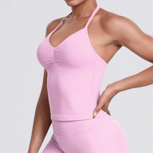 Detailed side view of pink seamless ribbed yoga set with ruched sports bra design