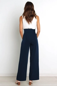Back view of high-waisted navy wide-leg trousers with elegant tailored belt detail