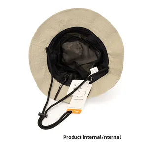 Macro view of quick-dry sun hat interior showing breathable mesh lining and chin strap