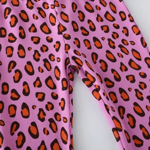 Pink ribbed knit leggings for girls with orange and brown leopard animal print