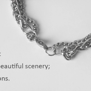 Close-up of silver stainless steel double layer chain bracelet with lobster clasp