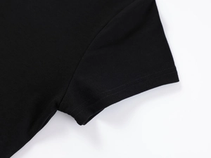 Detail of double-stitched cuffs and armhole on black modal slim-fit sports T-shirt