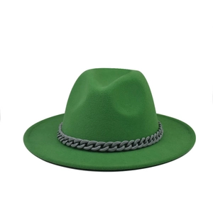 Detailed texture of green felt fedora hat with a grey chain link band decoration
