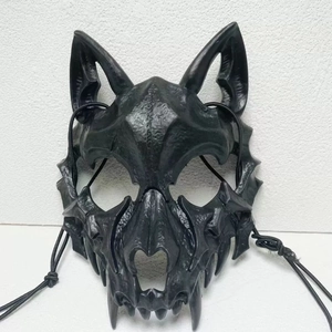 Macro shot of black wolf skull cosplay mask with sharp fangs and matte skeletal textures