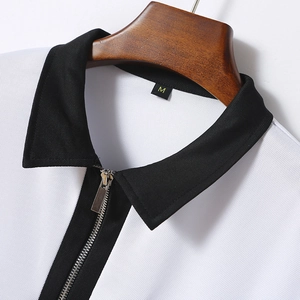Detail shot of men's polo collar with metal zipper and pique cotton fabric texture