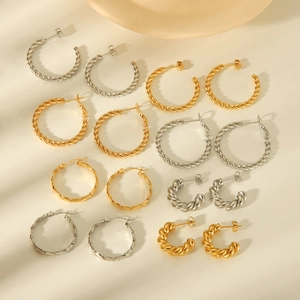 Polished C-shape titanium steel hoop earrings in gold and silver with twisted rope design