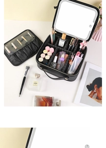 Detail of large black makeup case with built-in LED touch mirror and adjustable dividers